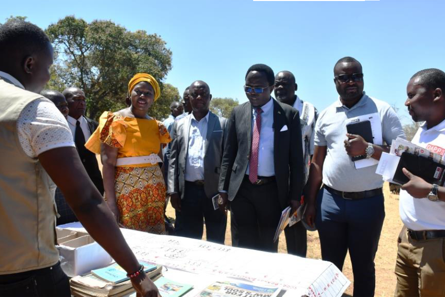 Kaira 4th R touring some pavilions accompanied by DAPP Malawi officials