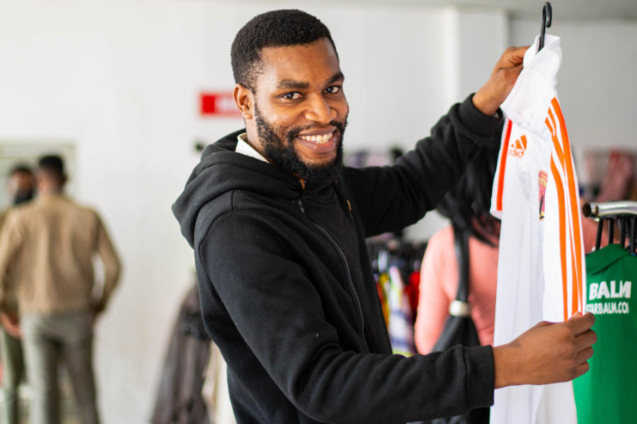 A Happy customer in one of our DAPP Malawi second-hand shops